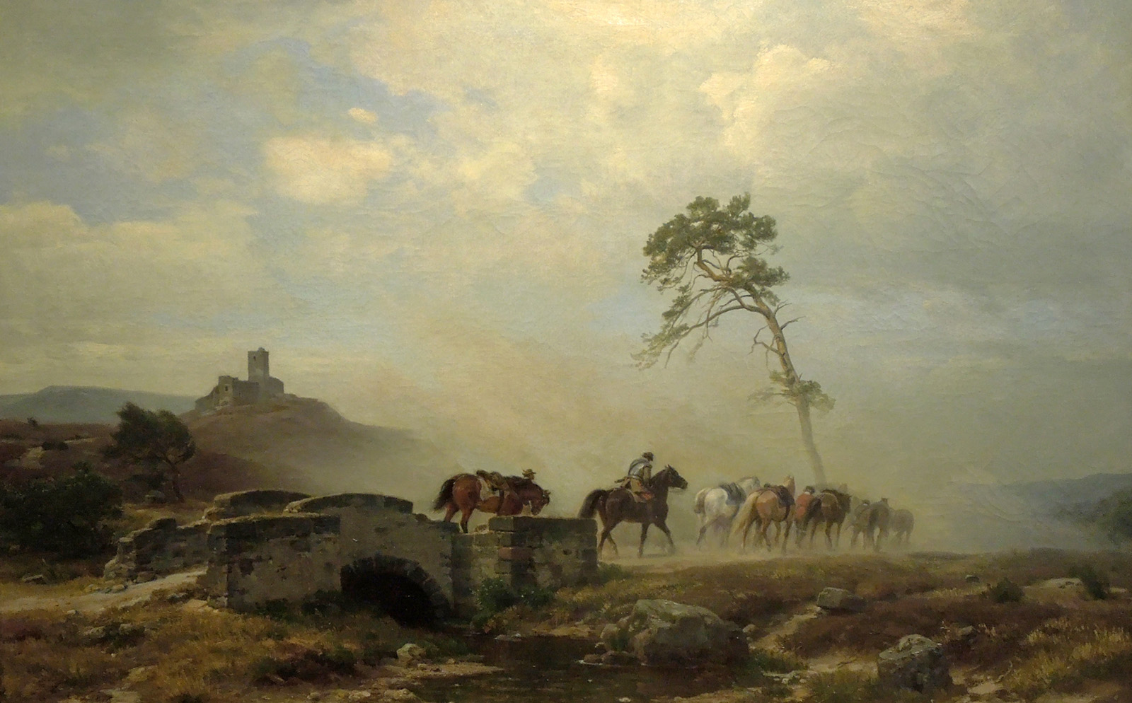landscape with castle ruins and riders